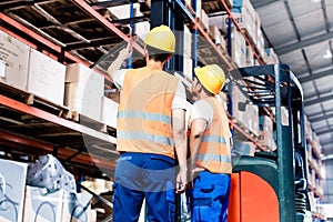 Worker team taking in logistics warehouse