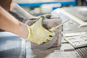 Worker technician work with soft PVC liquid rubber in mold