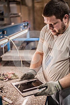 Worker technician work with soft PVC liquid rubber in mold