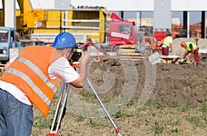 Worker with theodolite