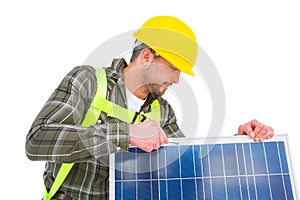 Worker tightening solar panel
