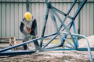 worker to cutting steel in construction site with Reciprocating saw or recip saw, saw used in construction and demolition work