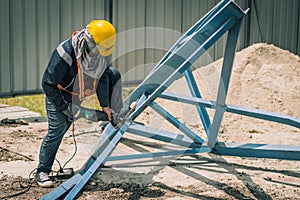 worker to cutting steel in construction site with Reciprocating saw or recip saw, saw used in construction and demolition work