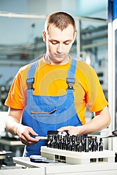 Worker at tool workshop