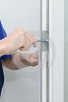 The worker twists the at assemblage