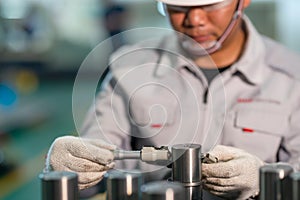 Worker use outside micrometer inspection high product in the production line