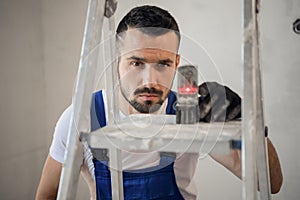 The worker uses an electronic ruler, close-up