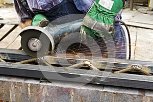 Worker using angle grinder