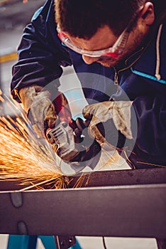 Worker Using Angle Grinder