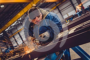 Worker Using Angle Grinder