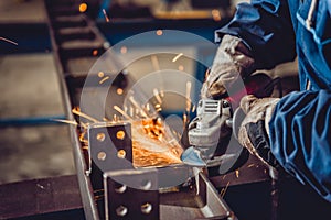 Worker Using Angle Grinder