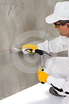 Worker using a dowel