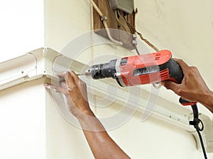Worker using drill