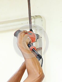 Worker using drill