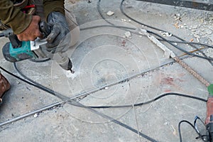 Worker using electric drill ground drilling by machine tool