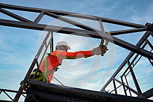 A worker are using Fall arrestor device for worker with hooks for safety body harness on onstruction site photo