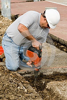 Worker using Hammer Chisel