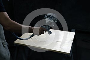 the worker is using a high pressure power tool to remove stains