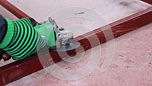 Worker using industrial grinder scrub steel