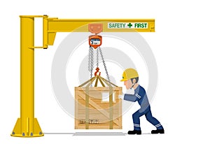 A worker is using the jib crane to handling the heavy wooden container on transparent background