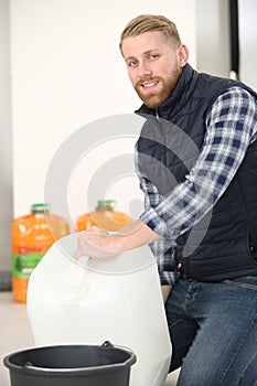worker using liquid container