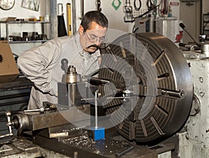 Worker using a Metal Lathe
