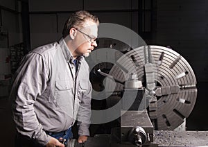 Worker using Metal Lathe