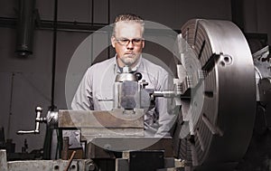 Worker using Metal Lathe