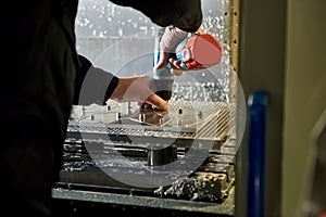 Worker is using a screwdriver.