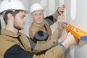 Worker using spirit level