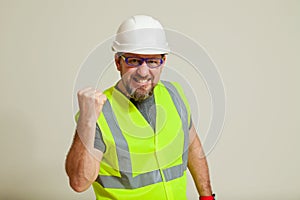 Worker in a vest and white helmet