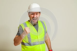 Worker in a vest and white helmet