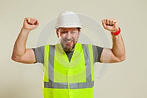 Worker in a vest and white helmet