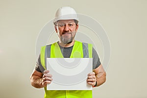 worker in a vest and white helmet