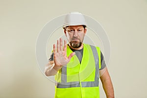 worker in a vest and white helmet