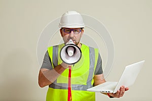 worker in a vest and white helmet