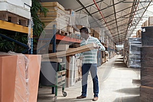 Worker of warehouse preparing boxes for dispatch
