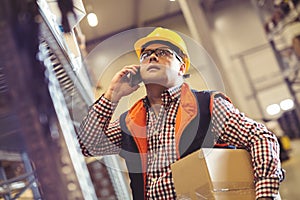 Worker In Warehouse Preparing Goods For Dispatch