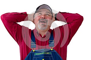 Worker wearing dungarees opening mouth