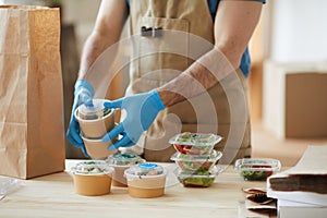 Worker Wearing Gloves at Food Delivery Service