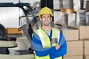 Worker wearing hard hat in warehouse