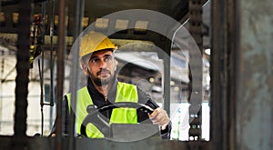 worker wearing helmet with driver forklift in warehouse