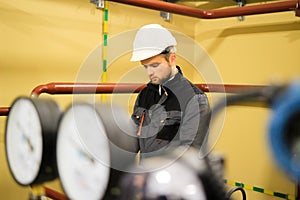 Worker wearing overalls and protective helmets