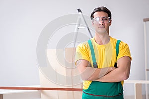 The worker wearing protective goggles at construction site