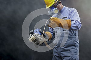 Worker wearing safety equipment, carpenter using spokeshave machine to decorate woodwork. mechanic staff working with machinery in