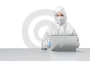 Worker wears medical protective suit or white coverall suit work with computer notebook isolated on white