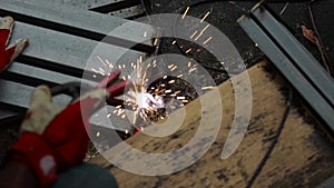 Worker weld steel metal welding spark blurred abstract bokeh background.