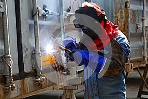 Worker welder container box maintenance