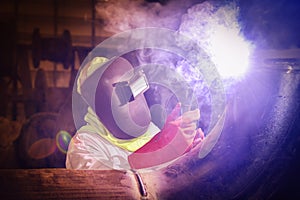 worker welding in factory