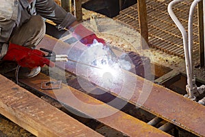 A worker welding the iron